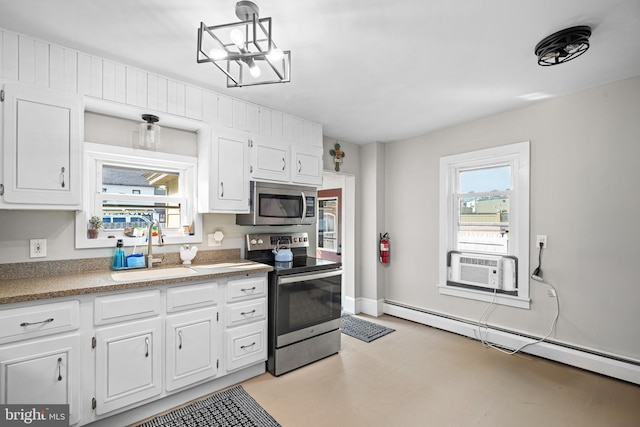 19 W Ave, Woodstown, NJ 08098 - kitchen featuring appliances with stainless steel finishes, a sink, a baseboard radiator, white cabinetry, and cooling unit