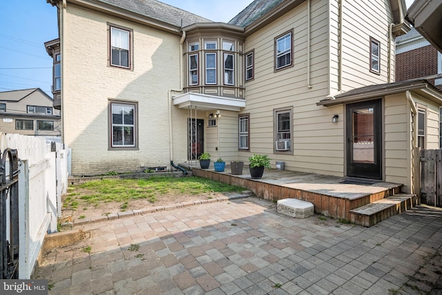 19 W Ave, Woodstown, NJ 08098 - back of house featuring a patio, a deck, cooling unit, and brick siding