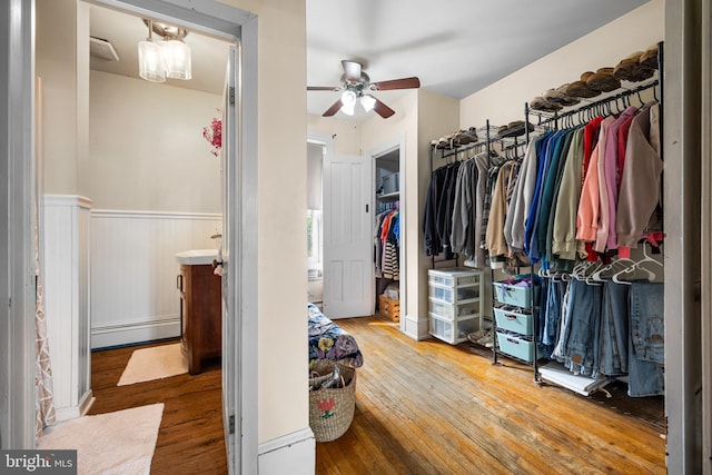 19 W Ave, Woodstown, NJ 08098 - walk in closet with a baseboard radiator, a ceiling fan, and hardwood / wood-style floors