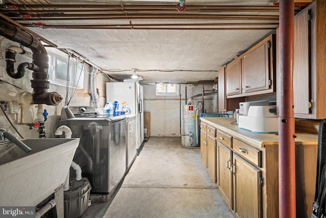 19 W Ave, Woodstown, NJ 08098 - basement with washing machine and dryer, water heater, a sink, and white refrigerator with ice dispenser