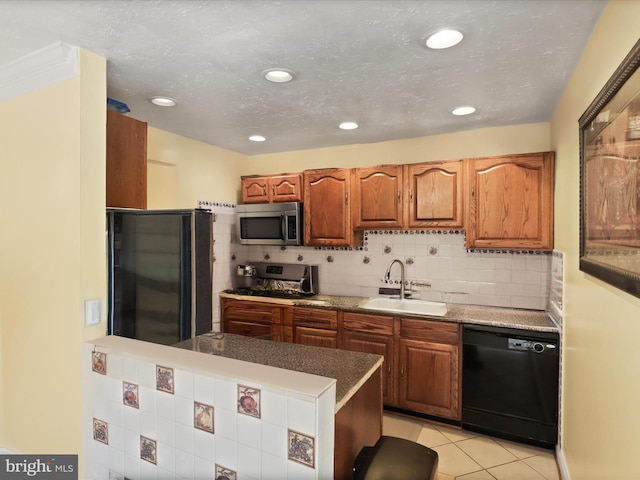 4807 Kempair Ct, Woodbridge, VA 22193 - kitchen with dishwasher, fridge, stainless steel microwave, a sink, and decorative backsplash
