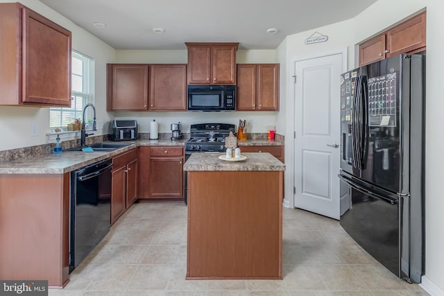 7 Schooner, Carneys Point, NJ 08069 - kitchen featuring black appliances, a center island, and brown cabinets