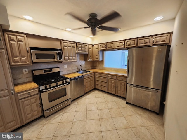 5100 Convent Ln Unit 412, Philadelphia, PA 19114 - kitchen with appliances with stainless steel finishes, light countertops, a ceiling fan, a sink, and recessed lighting