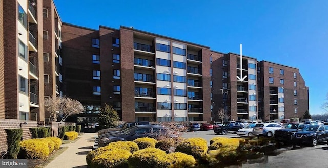 5100 Convent Ln Unit 412, Philadelphia, PA 19114 - view of apartment building / complex featuring uncovered parking