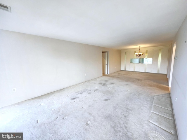 5100 Convent Ln Unit 412, Philadelphia, PA 19114 - unfurnished living room with a chandelier and light carpet