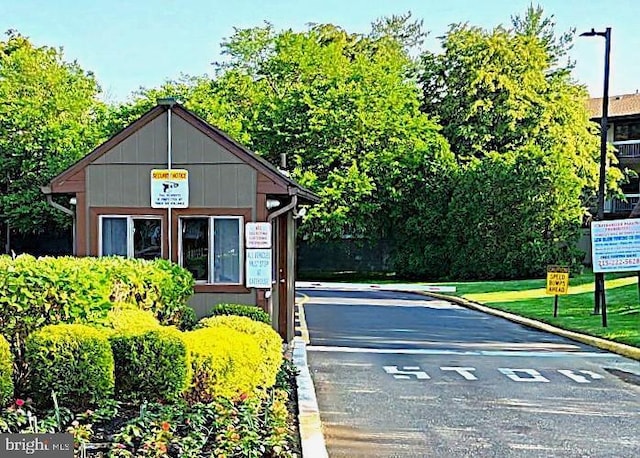 5100 Convent Ln Unit 412, Philadelphia, PA 19114 - view of asphalt road with curbs and street lights