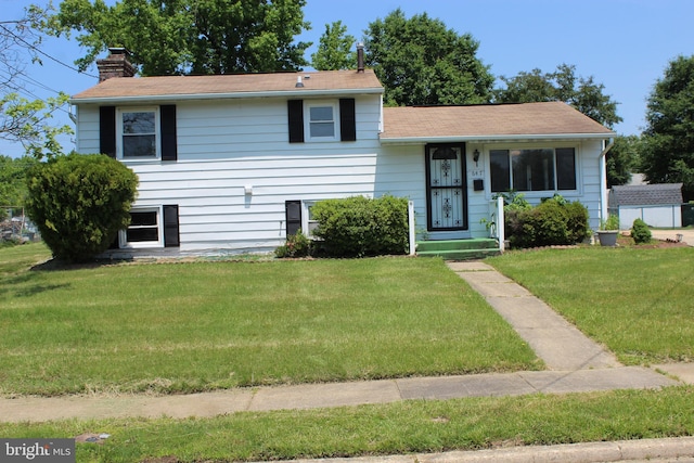 647 Elm St, Aberdeen, MD 21001 - tri-level home with a chimney and a front yard