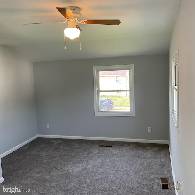 647 Elm St, Aberdeen, MD 21001 - empty room with dark colored carpet and ceiling fan