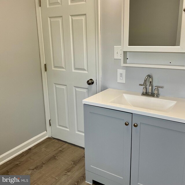 647 Elm St, Aberdeen, MD 21001 - bathroom featuring wood finished floors and vanity