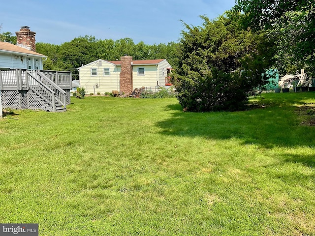647 Elm St, Aberdeen, MD 21001 - view of green lawn featuring a deck