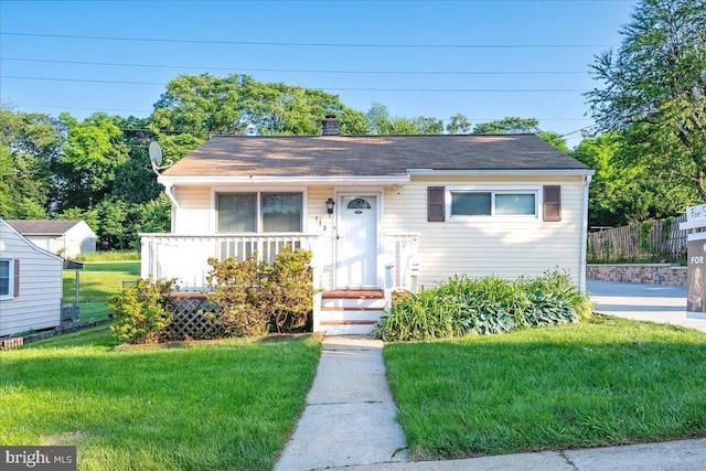 113 Wilgate Rd, Owings Mills, MD 21117 - bungalow featuring a front yard and a chimney