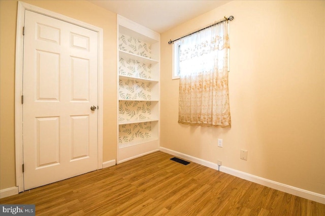 113 Wilgate Rd, Owings Mills, MD 21117 - unfurnished room featuring wood finished floors and baseboards