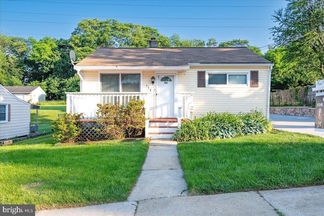 113 Wilgate Rd, Owings Mills, MD 21117 - bungalow with a front lawn, a chimney, and a shingled roof