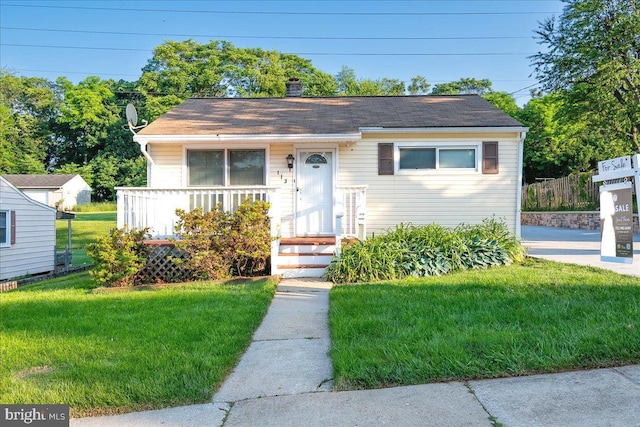 113 Wilgate Rd, Owings Mills, MD 21117 - bungalow-style house with a front yard and a chimney