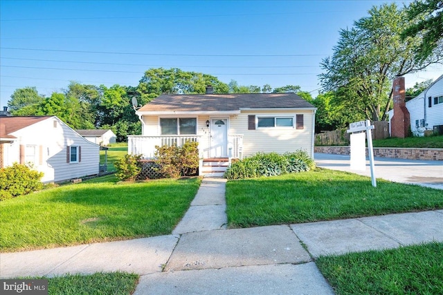 113 Wilgate Rd, Owings Mills, MD 21117 - bungalow-style home featuring a front lawn