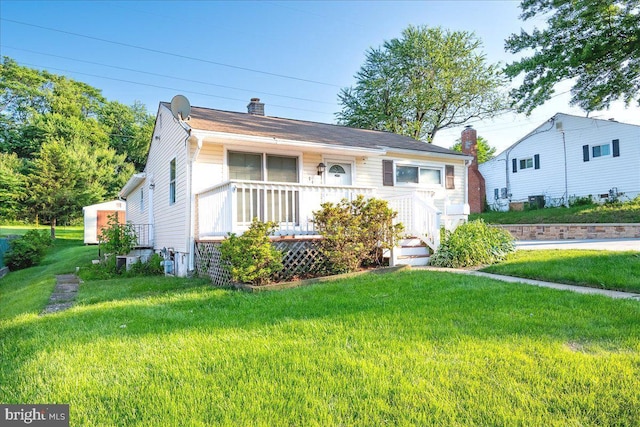 113 Wilgate Rd, Owings Mills, MD 21117 - view of front of home featuring a chimney and a front lawn