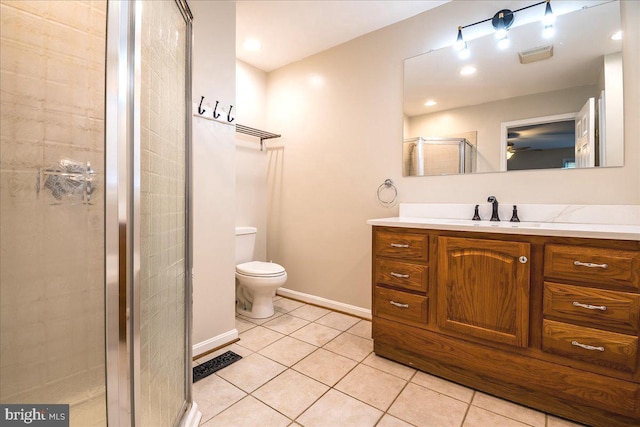113 Wilgate Rd, Owings Mills, MD 21117 - bathroom with vanity, a shower stall, tile patterned flooring, toilet, and baseboards