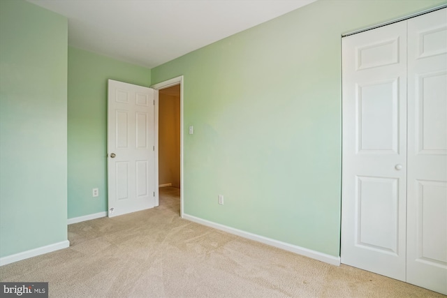 7484 Gadsby Sq, Alexandria, VA 22315 - unfurnished bedroom featuring carpet flooring, baseboards, and a closet