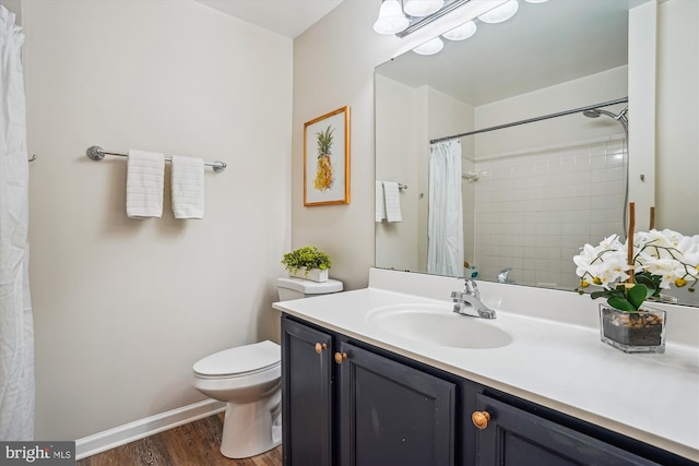 7484 Gadsby Sq, Alexandria, VA 22315 - bathroom featuring wood finished floors, toilet, vanity, and a shower with curtain