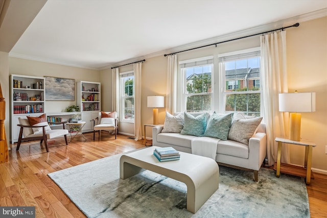7484 Gadsby Sq, Alexandria, VA 22315 - living room featuring light wood-style floors, crown molding, and baseboards