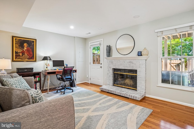 7484 Gadsby Sq, Alexandria, VA 22315 - office space featuring baseboards, wood finished floors, a brick fireplace, and recessed lighting