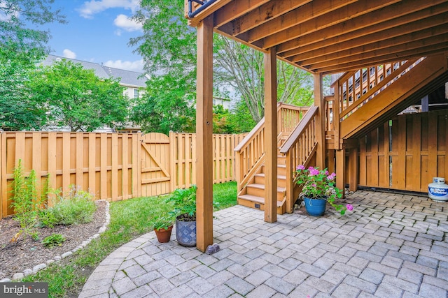 7484 Gadsby Sq, Alexandria, VA 22315 - fenced backyard featuring a patio area, a gate, and stairway