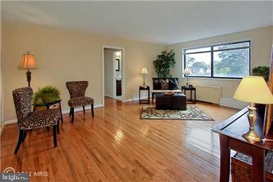 3515 Washington Blvd Unit 310, Arlington, VA 22201 - living room with wood finished floors and baseboards