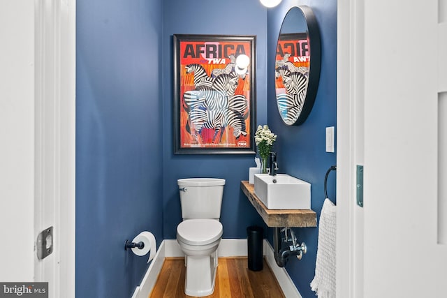1401 S Carolina Ave SE Unit 1, Washington, DC 20003 - half bathroom with wood finished floors and toilet