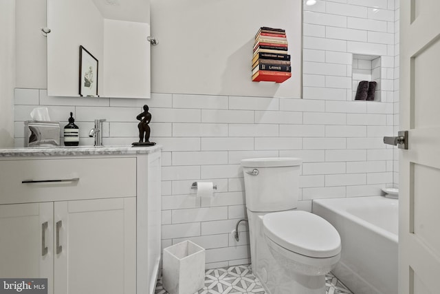 1401 S Carolina Ave SE Unit 1, Washington, DC 20003 - bathroom with tile walls, vanity, and tile patterned floors