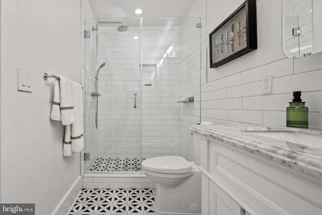 1401 S Carolina Ave SE Unit 1, Washington, DC 20003 - full bath featuring vanity, a shower stall, tile walls, and recessed lighting