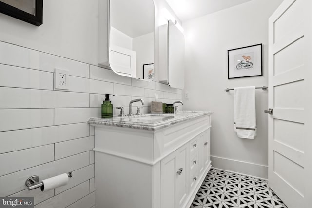 1401 S Carolina Ave SE Unit 1, Washington, DC 20003 - bathroom with double vanity, decorative backsplash, and tile patterned floors
