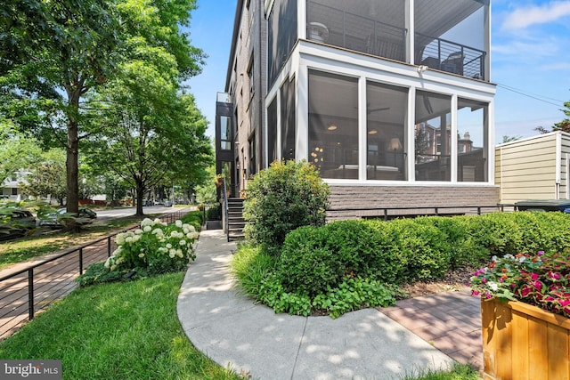 1401 S Carolina Ave SE Unit 1, Washington, DC 20003 - view of property exterior featuring a sunroom, a balcony, and stairway