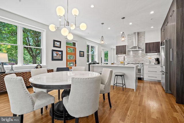 1401 S Carolina Ave SE Unit 1, Washington, DC 20003 - dining room with light wood finished floors, recessed lighting, and a chandelier