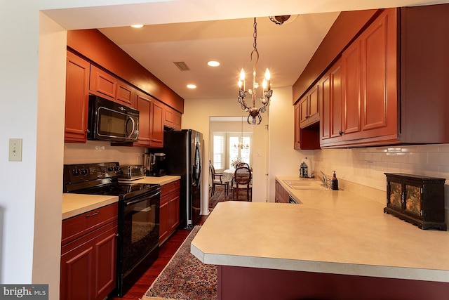 32 Hunters Way W, Newtown, PA 18940 - kitchen featuring black appliances, a chandelier, light countertops, decorative backsplash, and recessed lighting