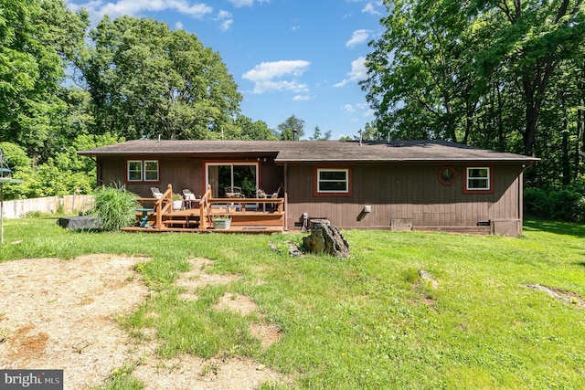 1214 Minnich Rd, Mechanicsburg, PA 17055 - back of house featuring a deck and a lawn