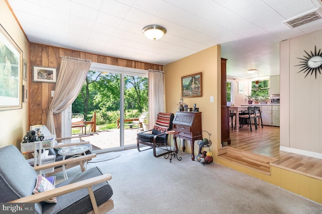 1214 Minnich Rd, Mechanicsburg, PA 17055 - living area featuring light carpet and wooden walls