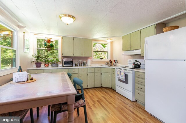 1214 Minnich Rd, Mechanicsburg, PA 17055 - kitchen with white appliances, under cabinet range hood, light wood finished floors, and light countertops