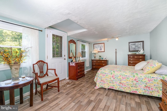 1214 Minnich Rd, Mechanicsburg, PA 17055 - bedroom featuring wood finished floors and a textured ceiling