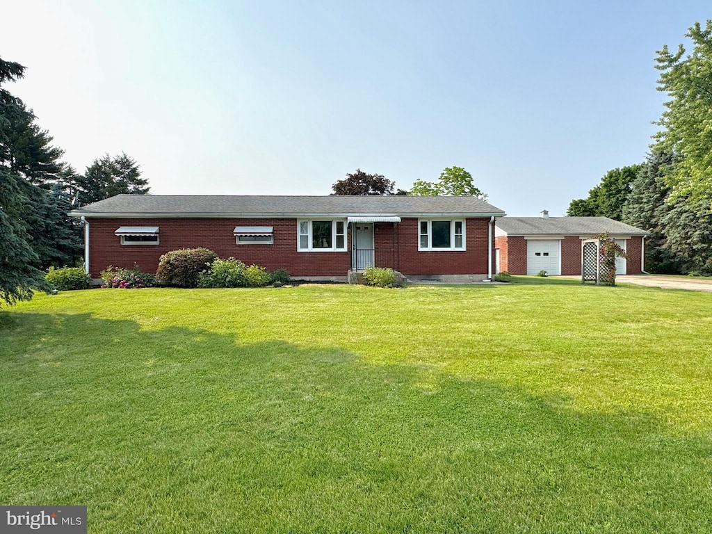 185 Strack Dr, Myerstown, PA 17067 - ranch-style house with brick siding, a front lawn, a garage, and concrete driveway