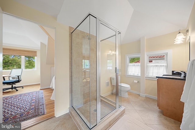 2811 35th St NW, Washington, DC 20007 - bathroom with a shower stall, toilet, baseboards, tile patterned floors, and lofted ceiling