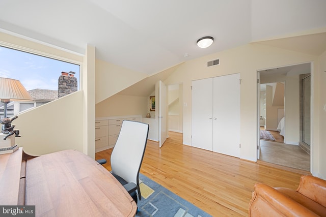 2811 35th St NW, Washington, DC 20007 - home office featuring light wood-style flooring and vaulted ceiling