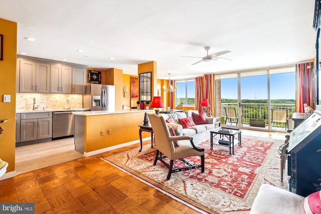 3001 Veazey Ter NW Unit 1632, Washington, DC 20008 - living area featuring ceiling fan, floor to ceiling windows, a chandelier, and recessed lighting