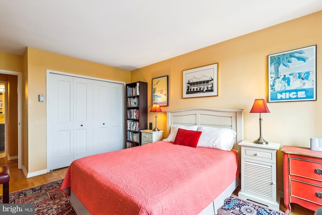 3001 Veazey Ter NW Unit 1632, Washington, DC 20008 - bedroom with a closet, baseboards, and wood finished floors