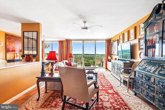 3001 Veazey Ter NW Unit 1632, Washington, DC 20008 - living room with healthy amount of natural light, a ceiling fan, wood finished floors, and baseboards