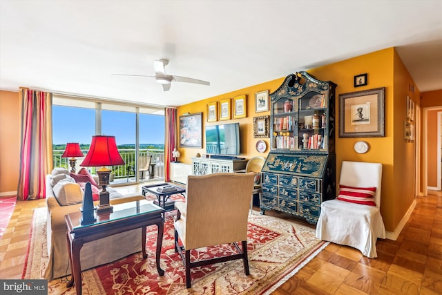 3001 Veazey Ter NW Unit 1632, Washington, DC 20008 - living room featuring ceiling fan, floor to ceiling windows, and baseboards