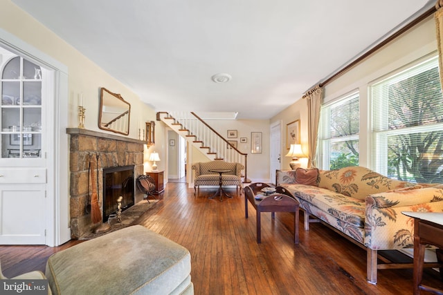 1033 Lenape Rd, West Chester, PA 19382 - living room with a stone fireplace, hardwood / wood-style floors, stairs, and baseboards