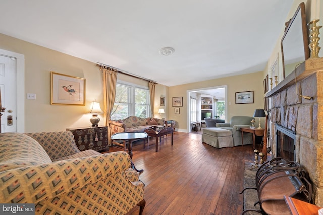 1033 Lenape Rd, West Chester, PA 19382 - living area featuring hardwood / wood-style flooring and a brick fireplace