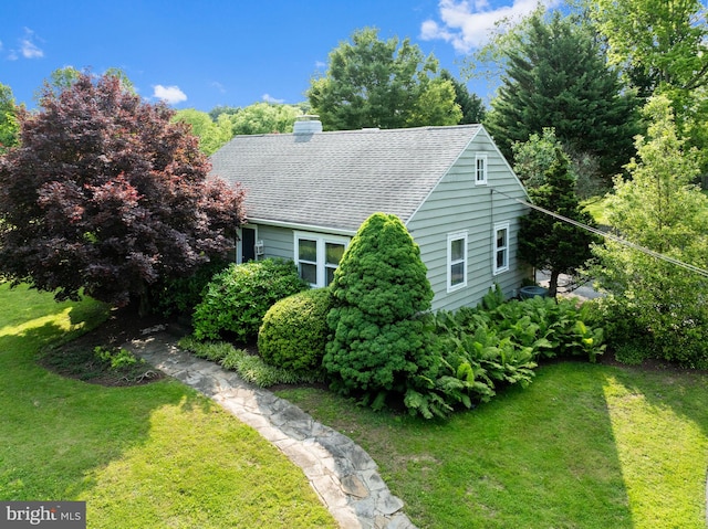 1033 Lenape Rd, West Chester, PA 19382 - view of side of home featuring a lawn, a chimney, and a shingled roof
