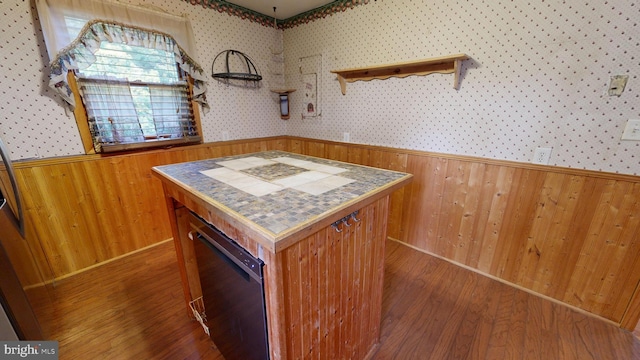 6085 Mud Mill Rd, Camden Wyoming, DE 19934 - kitchen featuring a wainscoted wall, wood walls, wood finished floors, wallpapered walls, and a center island