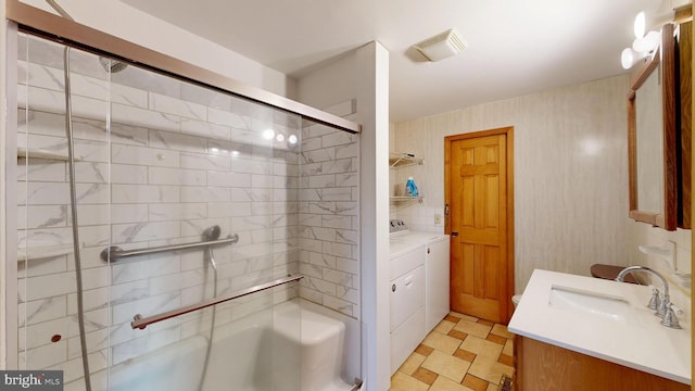 6085 Mud Mill Rd, Camden Wyoming, DE 19934 - full bathroom with separate washer and dryer, vanity, and shower / bath combination with glass door